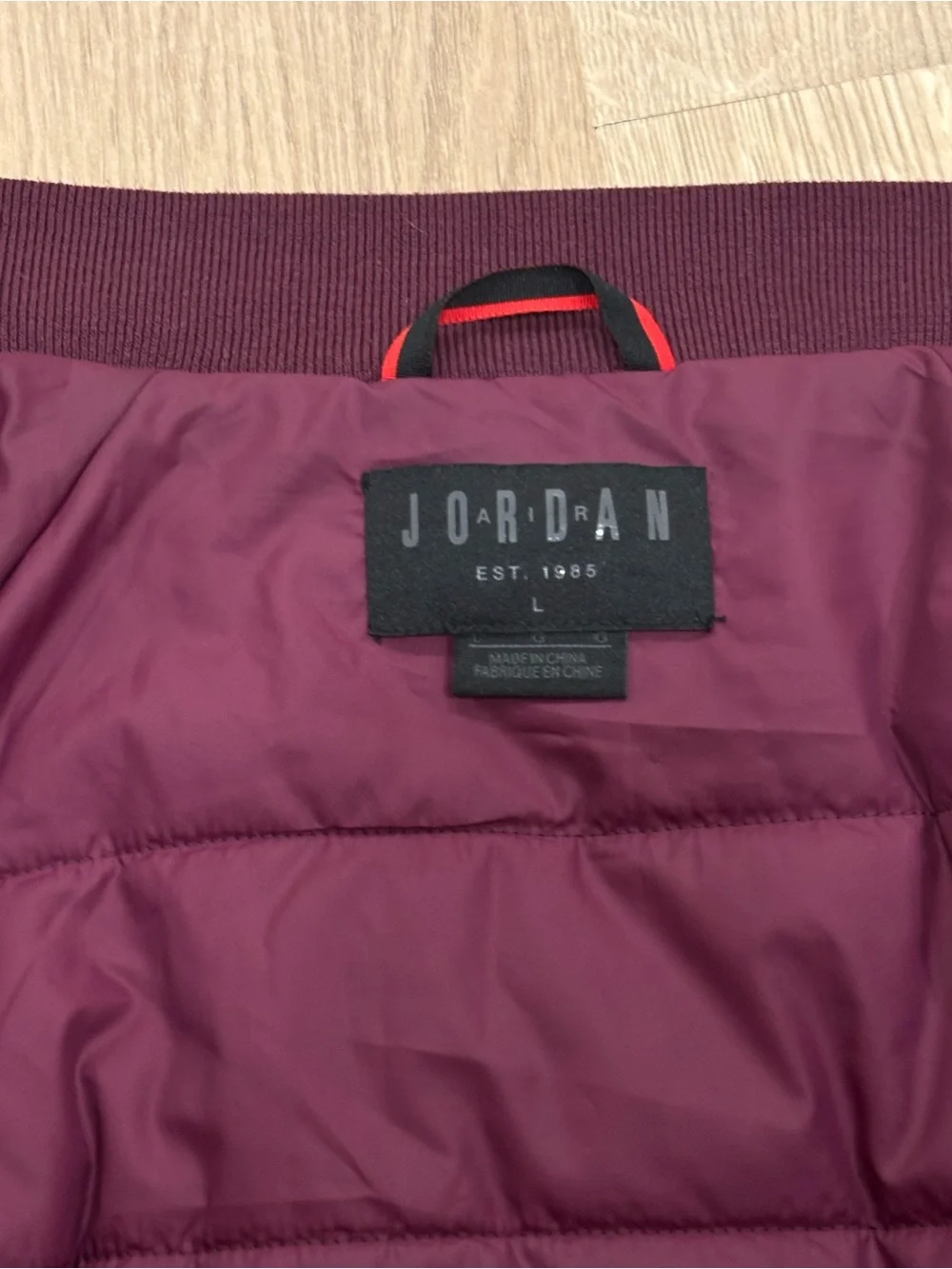 Classic Jordan Sportswear Wings MA-1 jacket features a burgundy wine colorway
